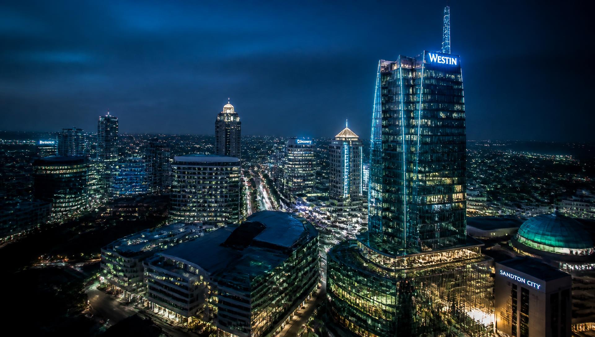 Aerial view of a modern South African business district at dusk